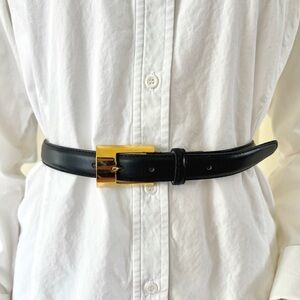 vintage navy blue leather skinny belt with gold tone buckle by Gail Labelle